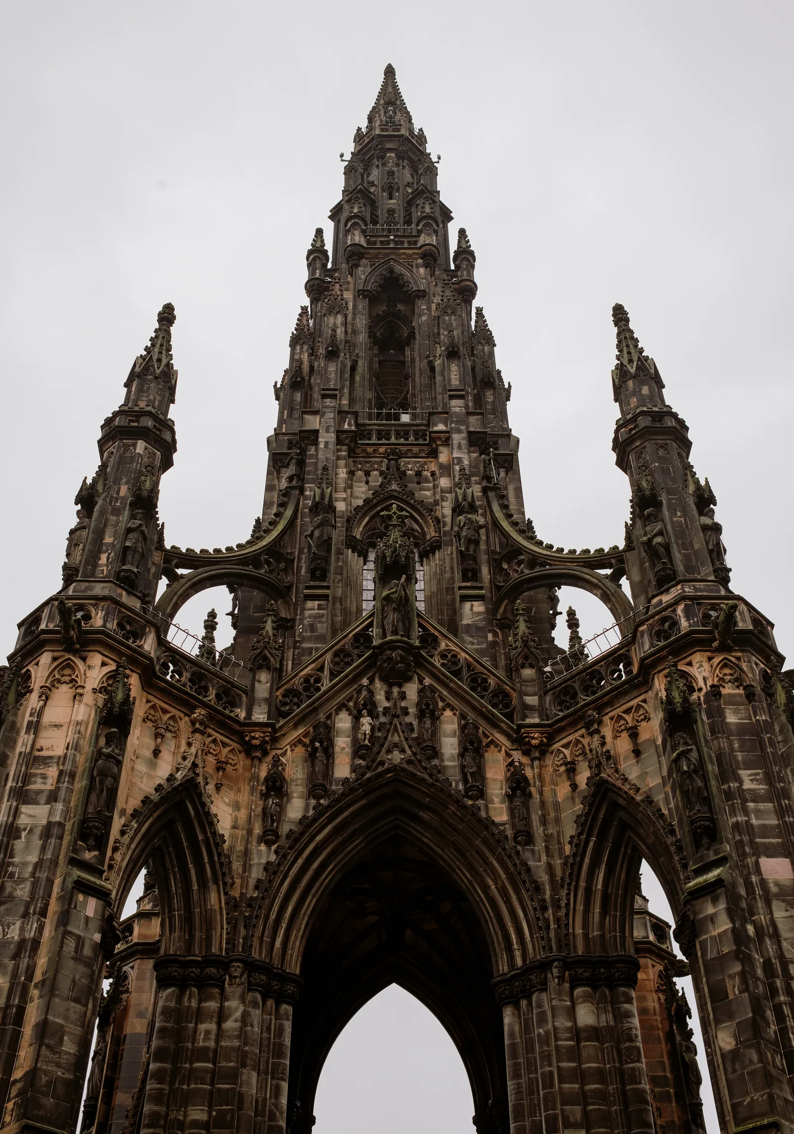 Looking up at the Scott Monument's dark Gothic spire and arches, Edinburgh