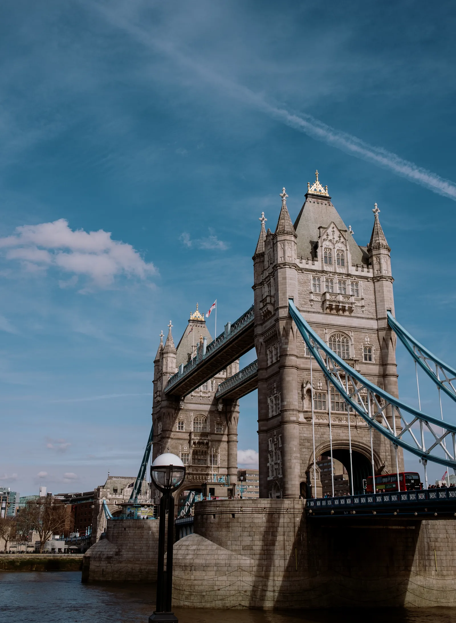 Tower Bridge and its blue suspension walkways under a blue sky, London