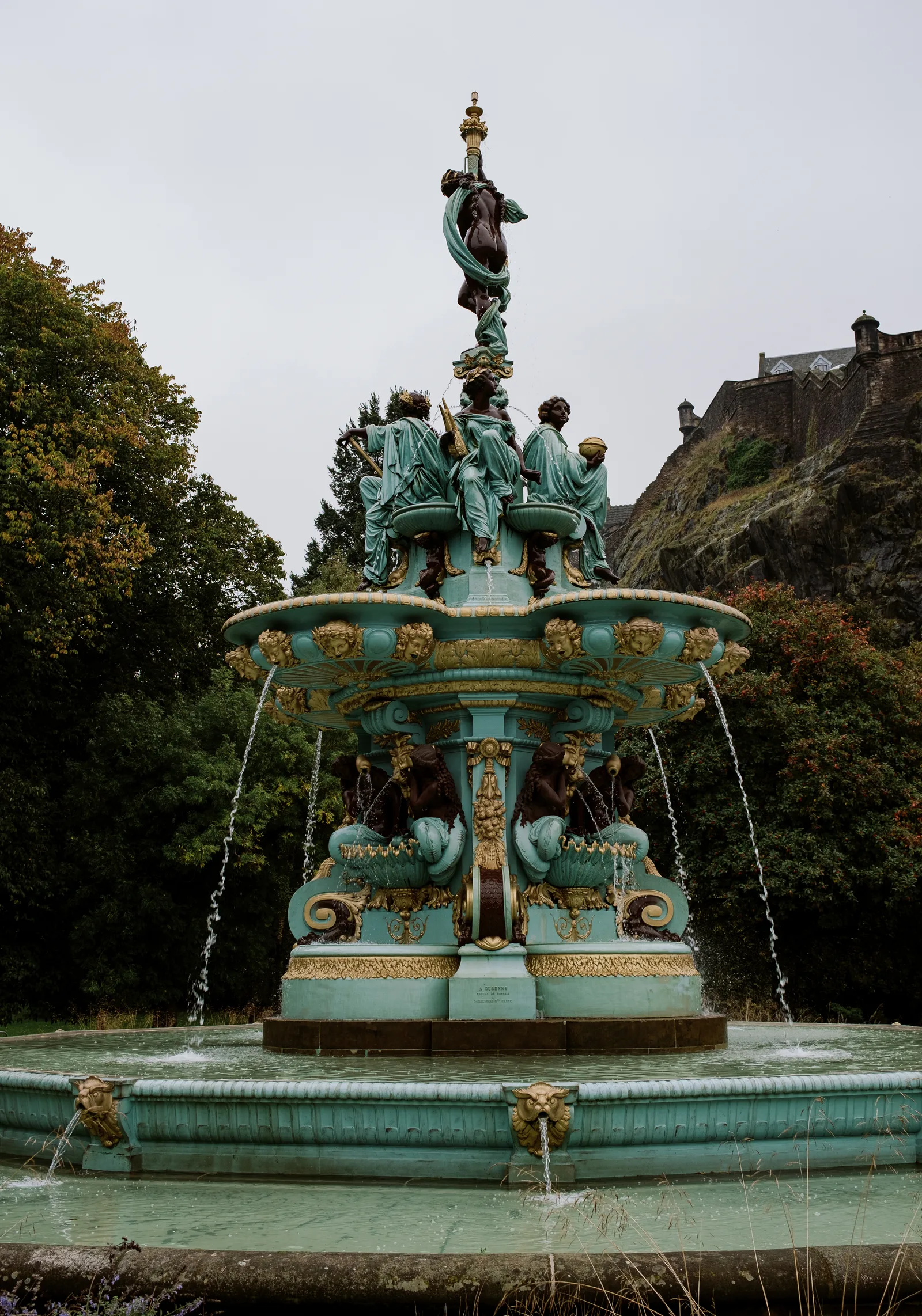 Ornate teal and gold Ross Fountain with the castle rock behind, Edinburgh