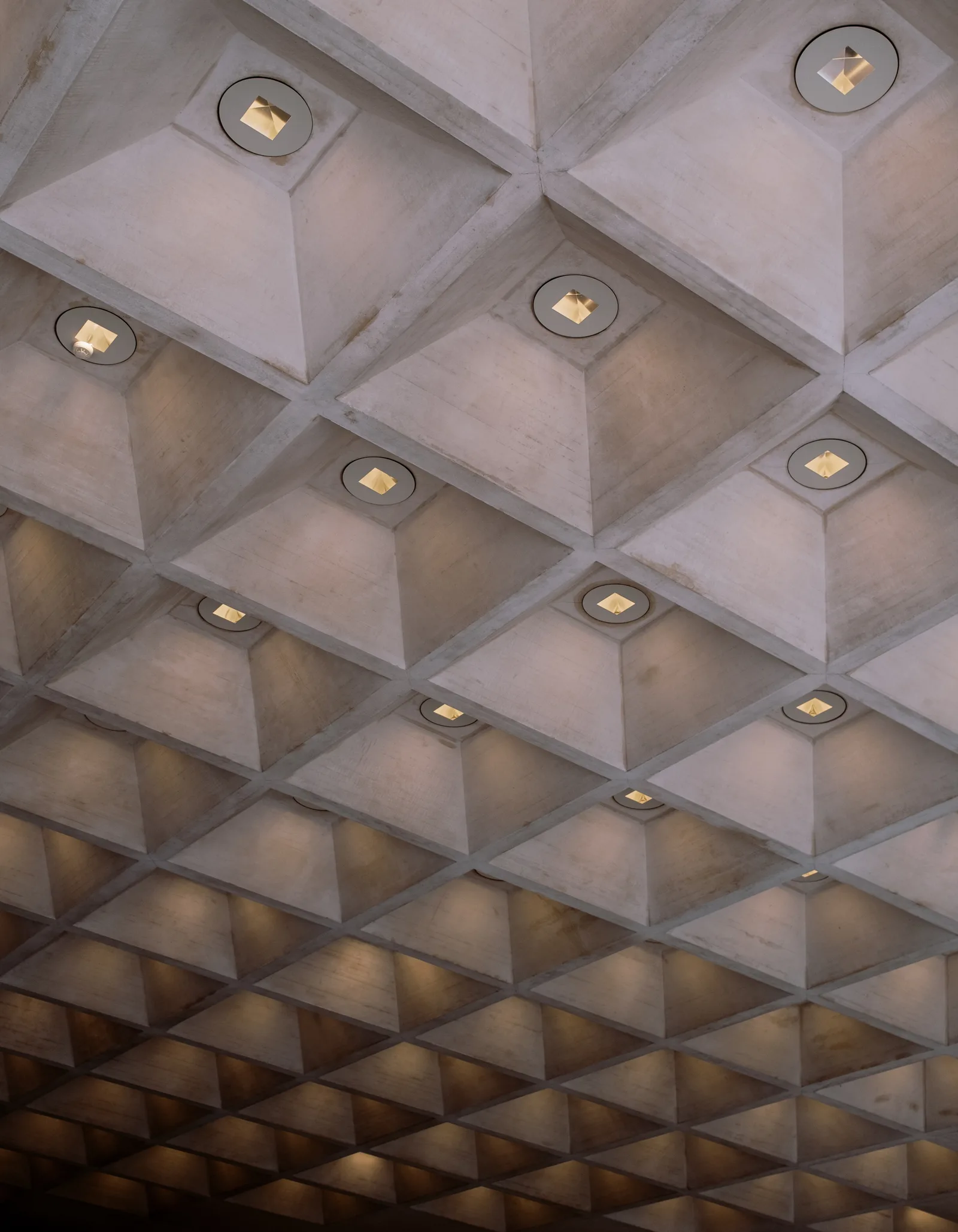 Waffled concrete ceiling with recessed lights, Paris