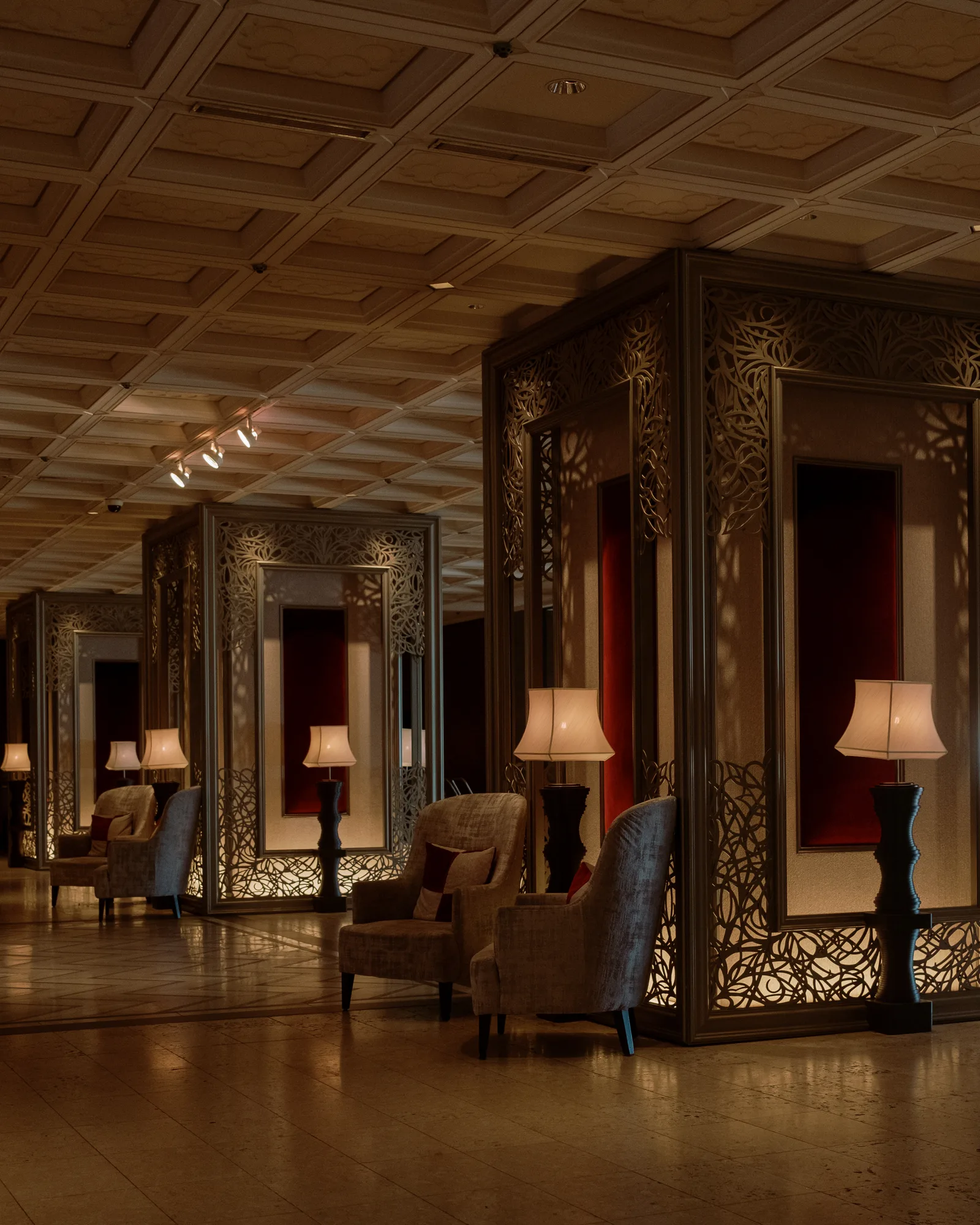 Hotel lobby with a coffered ceiling, table lamps and ornate screens, Tokyo