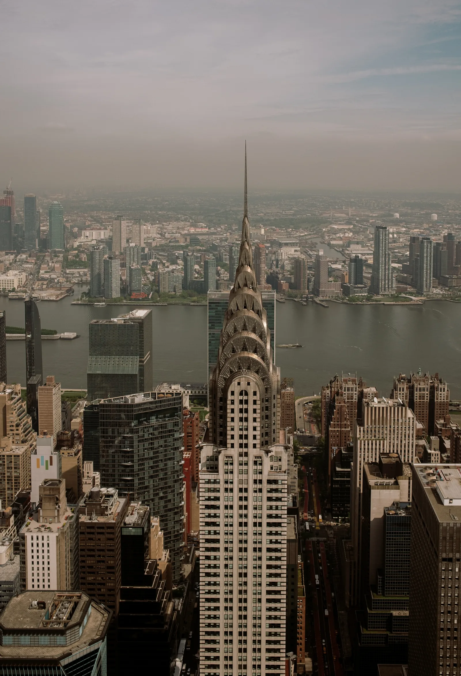 Chrysler Building and the East River from above, New York in haze